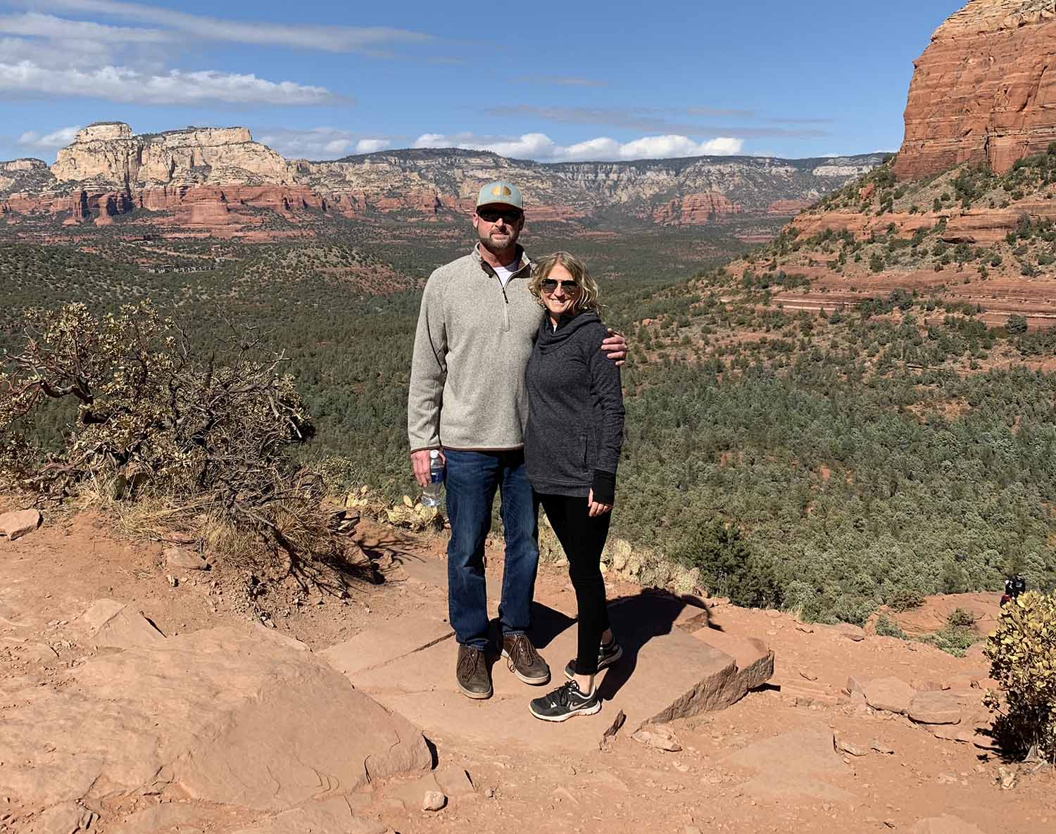 Bryan Walters and his wife standing in front of beautiful scenery.