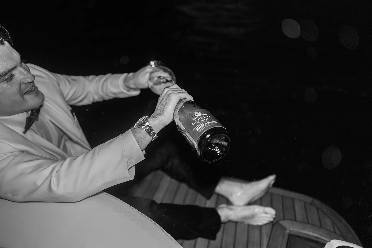 Pouring wine on a boat